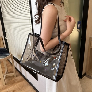 Transparent PVC tote bag with colorful rhinestones and black faux leather trim handles