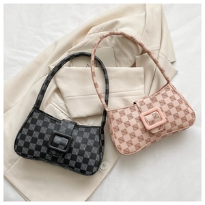 Detail of vintage square underarm bags in black and pink with letter checkerboard patterns