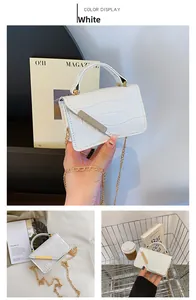 Detailed view of white stone texture mini handbag with gold chain strap and metal clasp