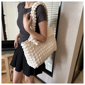 White puffy bubble texture tote bag with wide shoulder strap and zipper detail