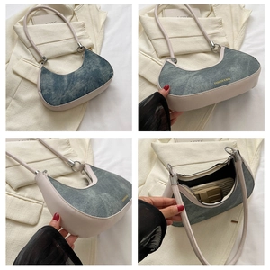 Detailed views of a crescent underarm bag in denim blue and cream faux leather