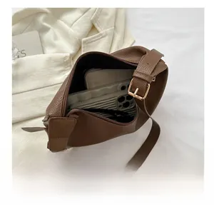 Internal view showing capacity of the brown lychee pattern tote bag with wide strap