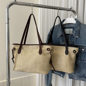 Large woven tote bag with contrast straps and minimalist summer straw design