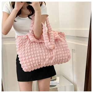 Detail of pink bubble texture tote bag with large capacity for daily casual style