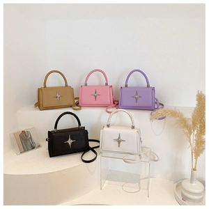 Five assorted colors of textured leather crossbody bags with star buckles and woven handles