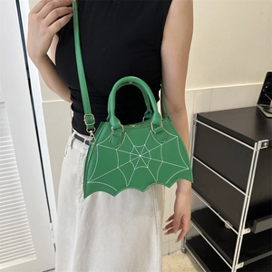 Green spider web embroidered handbag in bat wing shape with detachable crossbody strap