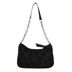 Fashionable black crescent shoulder bag with floral embossing and silver chain strap