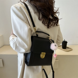 British style black leather backpack for women with vintage gold buckle and pink charm