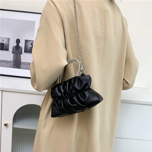 Chic black pleated cloud bag with sparkling rhinestone handle and silver chain strap