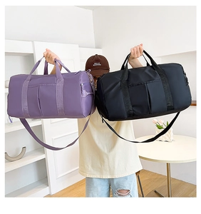 Detailed view of purple and black waterproof gym bags with dry-wet separation pocket