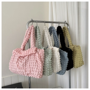 Detail showing various colors and bubble texture fabric of the chic shoulder bag