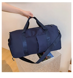 Macro shot of navy blue waterproof gym bag with reinforced handles and adjustable strap