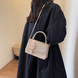 Elegant beige sequin crossbody handbag with metal buckle and top handle for women