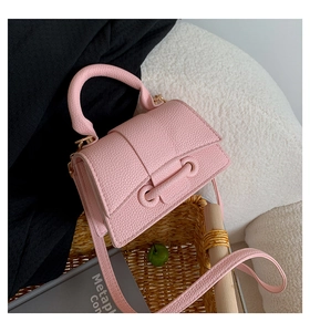 Pink litchi texture leather mini square bag with thick handle and thin crossbody strap
