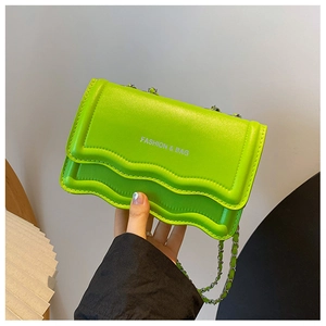 Detail of green wavy flap bag with metal chain strap and fashion lettering print