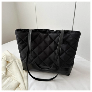 Close-up of quilted oxford fabric tote bag with diamond stitching and durable base