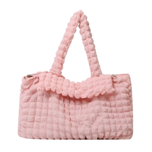 Pink bubble fabric tote bag with textured surface and top handles for casual use