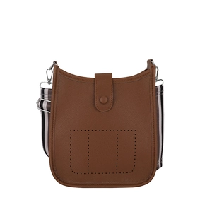Brown litchi leather bucket bag with perforated design and striped fabric strap