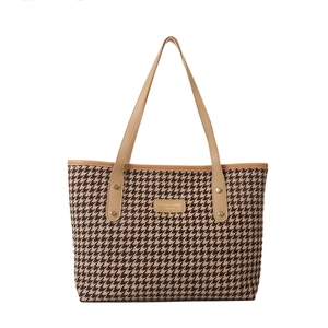 Brown houndstooth tote bag with leather straps and golden metal logo plate