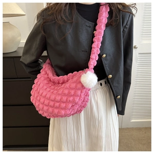Detailed pink pleated bag with bubble texture and white fluffy pompom pendant