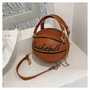 Close-up of orange basketball-shaped bag with PU leather texture and gold chain strap