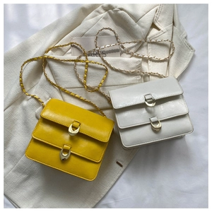 Detail of vintage square crossbody bags with unique double flap and crescent metal buckle
