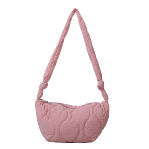 Pink quilted shoulder bag with wavy stitching and knots on a clean white background