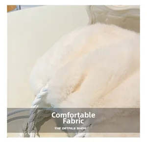 Close-up of soft plush faux fur fabric and woven white leather strap on shoulder bag