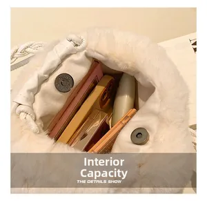 Detail view of the interior space of white faux fur handbag with magnetic closure