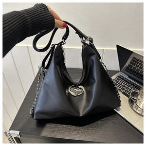 Detail of black matte leather hobo bag with silver metal logo and chain strap
