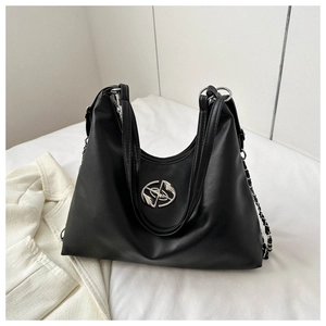 Detail of black large hobo bag with silver oval logo and leather chain strap