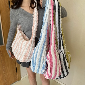 Quilted bubble texture shoulder bag with vibrant contrast stripes and spacious interior