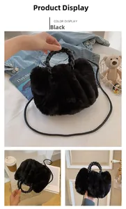 Detail of black faux fur plush handbag with round woven handle and leather crossbody strap