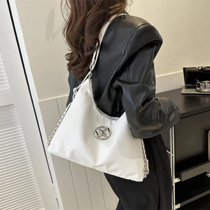 Minimalist white hobo bag with silver logo, dual chain strap shown on black leather outfit