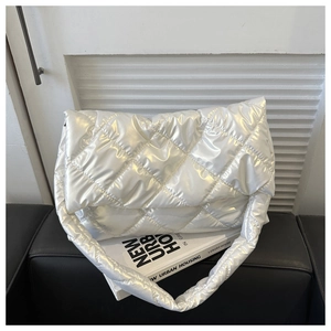 Macro view of white pearlescent quilted texture on this large nylon cloud hobo bag