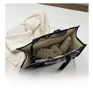 Spacious ethnic pattern tote bag showing large capacity for phone, wallet and umbrella