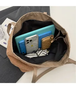 Macro view of plush brown tote bag interior showing spacious capacity for tablets and daily items