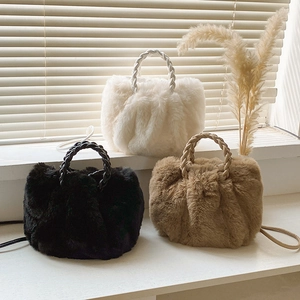 Chic plush faux fur cloud bags with braided handles in white, black, and khaki caramel