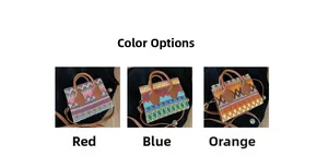 Detailed view of ethnic woven crossbody bag in red, blue, and orange geometric patterns