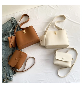 Detailed flat lay of beige and brown PU leather tote bags and square crossbody purses