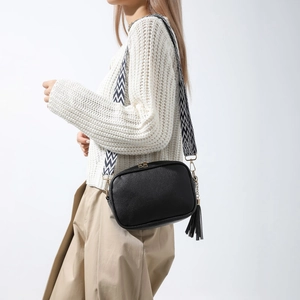 Fashionable black litchi grain crossbody bag with geometric wide strap and tassel