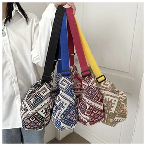 Detail showing ethnic geometric woven crossbody bags with adjustable nylon shoulder straps