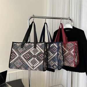 Bohemian style canvas tote bags with geometric patterns in black, blue and red finishes