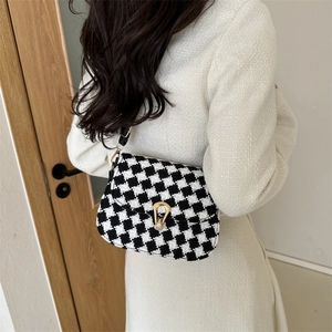 Houndstooth pattern crossbody bag for women with gold shell clasp and black strap