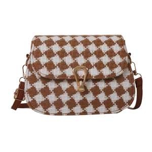 Classic houndstooth crossbody bag with woven texture and gold horseshoe buckle