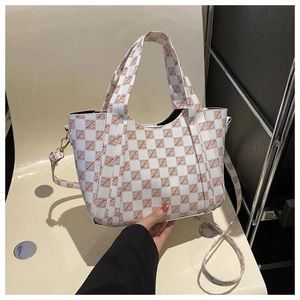 Close-up of checkered pattern tote bag with letter prints and detachable shoulder strap