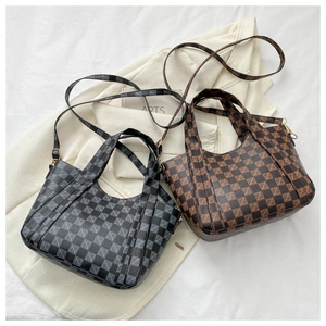 Detailed view of vintage checkered bucket bags in black and brown with golden hardware