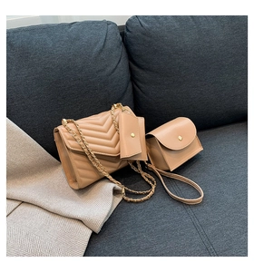 Close-up of beige quilted PU leather crossbody bag with gold chain strap and mini pouches