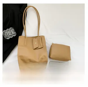 Three-piece khaki leather tote set with crossbody strap and small pouches shown in detail