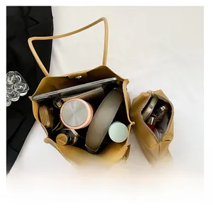 Detailed view of large tote bag interior capacity with iPad and daily essentials